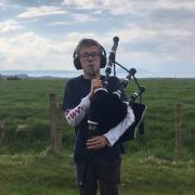 Fergus Goldie, 12, with his pipes.