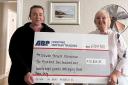 ABP’s Jenna Croasdale (left) donating a cheque of £10,228.83 to Helen Russell Newton (right) of Newton Tenant’s Association