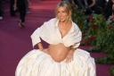Sienna Miller showed off her baby bump on the Vogue World red carpet (Yui Mok/PA)