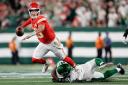 Kansas City Chiefs quarterback Patrick Mahomes (15) is tripped up by New York Jets linebacker Bryce Huff (47) (Adam Hunger/AP)