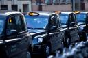 People in London will be able to order black cabs through Uber from early next year, the app company has announced (Alamy/PA)