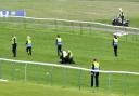 Protesters on the course at Ayr before the Scottish Grand National on April 22