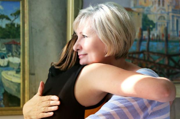 Ayr Advertiser: Mother and daughter hugging. Credit: Canva