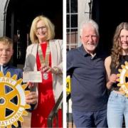 Troon Rotary members hand over cheques to  Dean and Megan