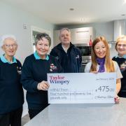 Troon RNLI representatives with the latest donation of £1,150 from Taylor Wimpey West Scotland’s local sales executive Lynsey Sloan