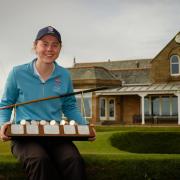 Ellie Monk celebrates winning the Helen Holm Scottish Women's Open.